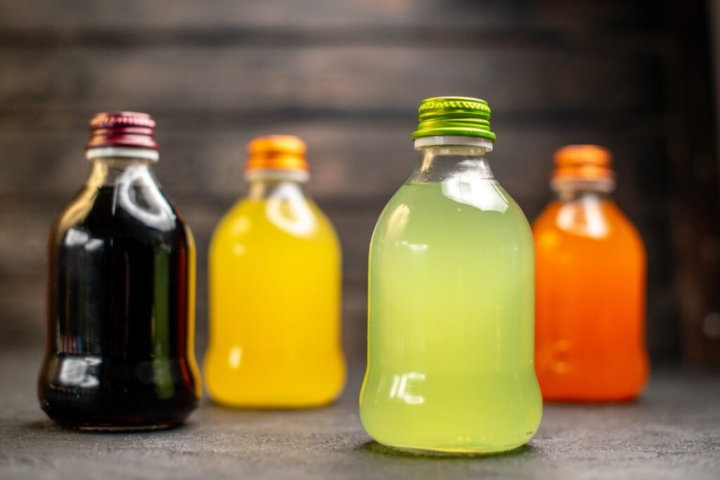 front-view-black-yellow-green-orange-juice-bottles (2)
